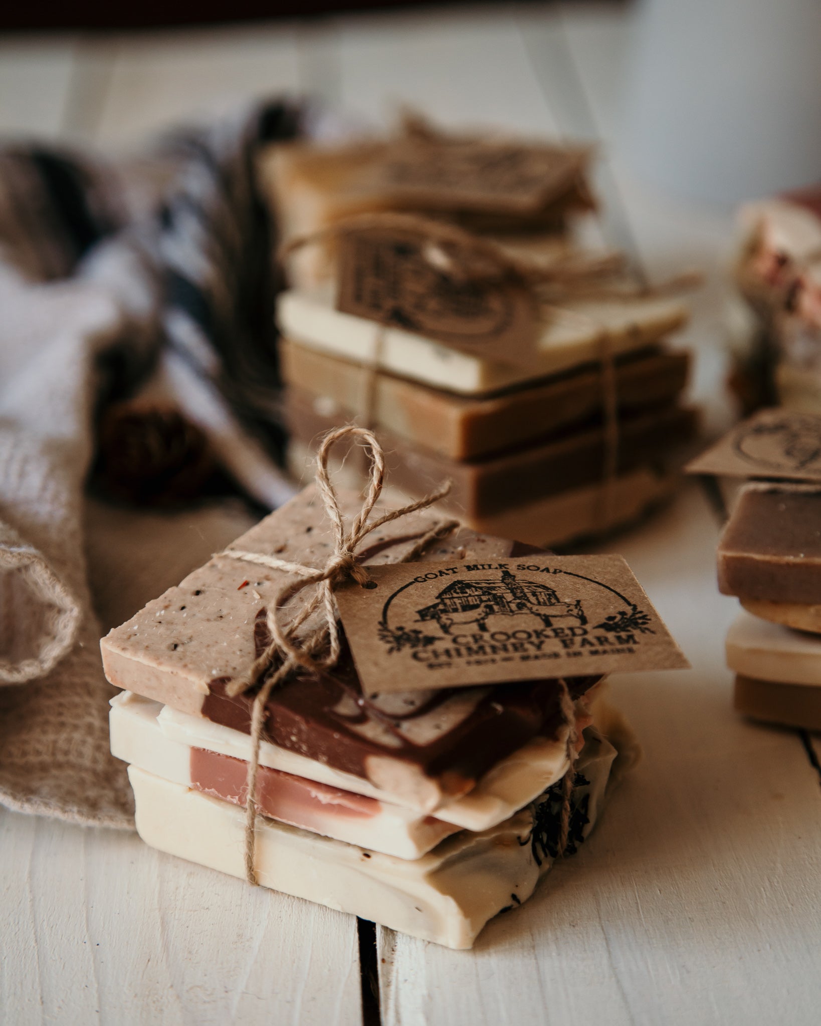 4 goat milk soap ends tied together in a bundle with twine