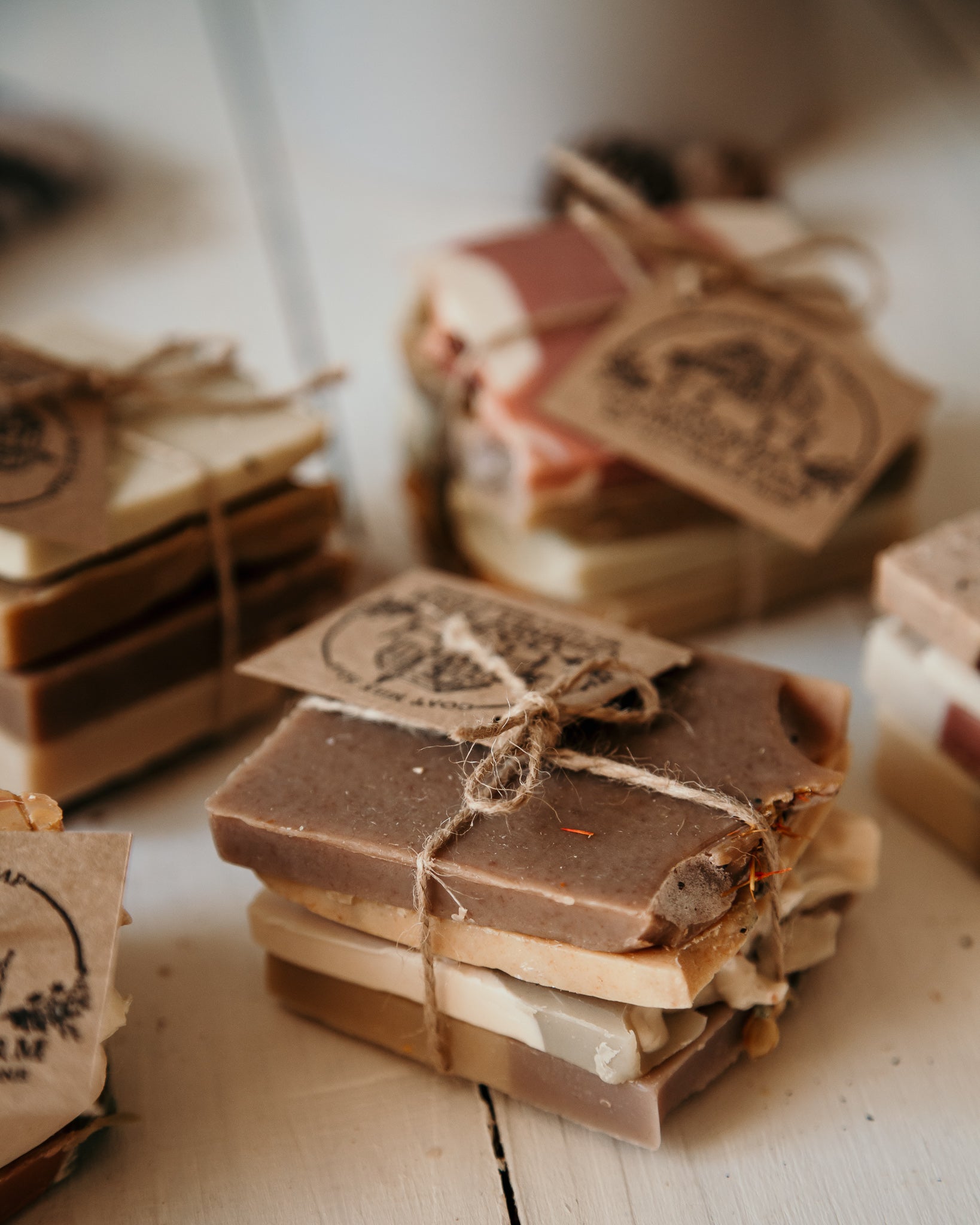 4 goat milk soap ends tied together in a bundle with twine